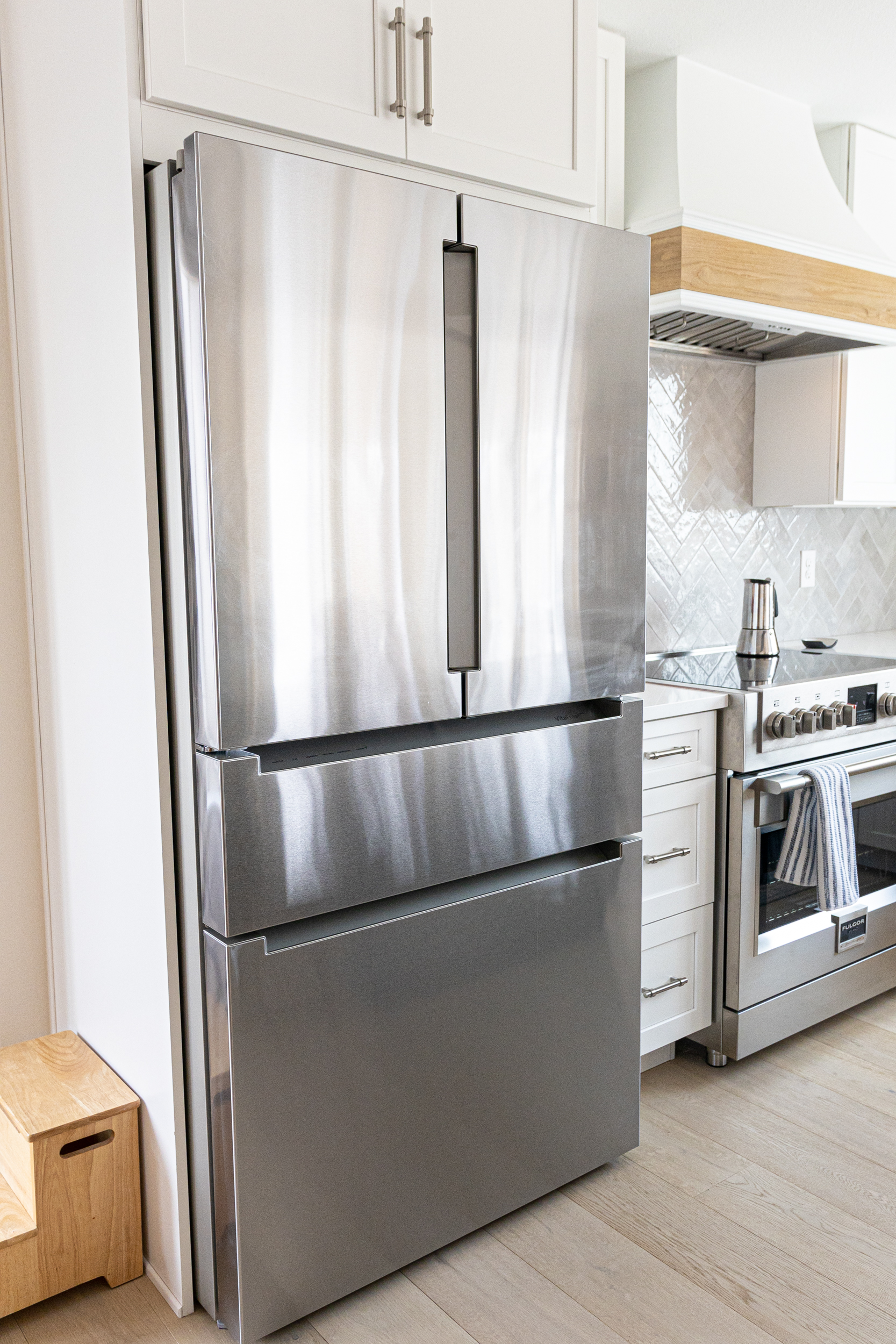 Stainless steel refrigerator in modern kitchen